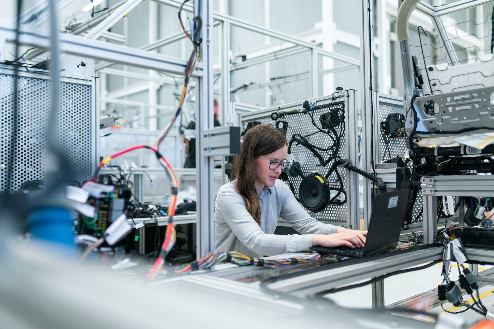 photo of female engineer working on her workspace