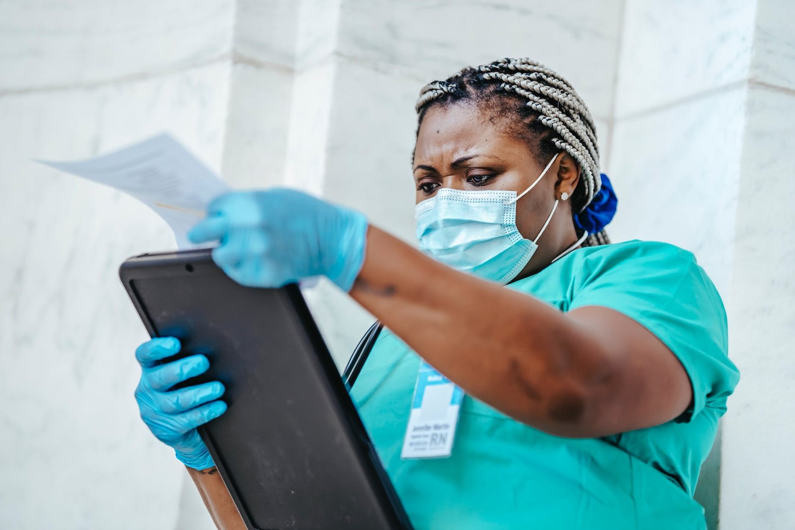 concentrated african american woman with documents