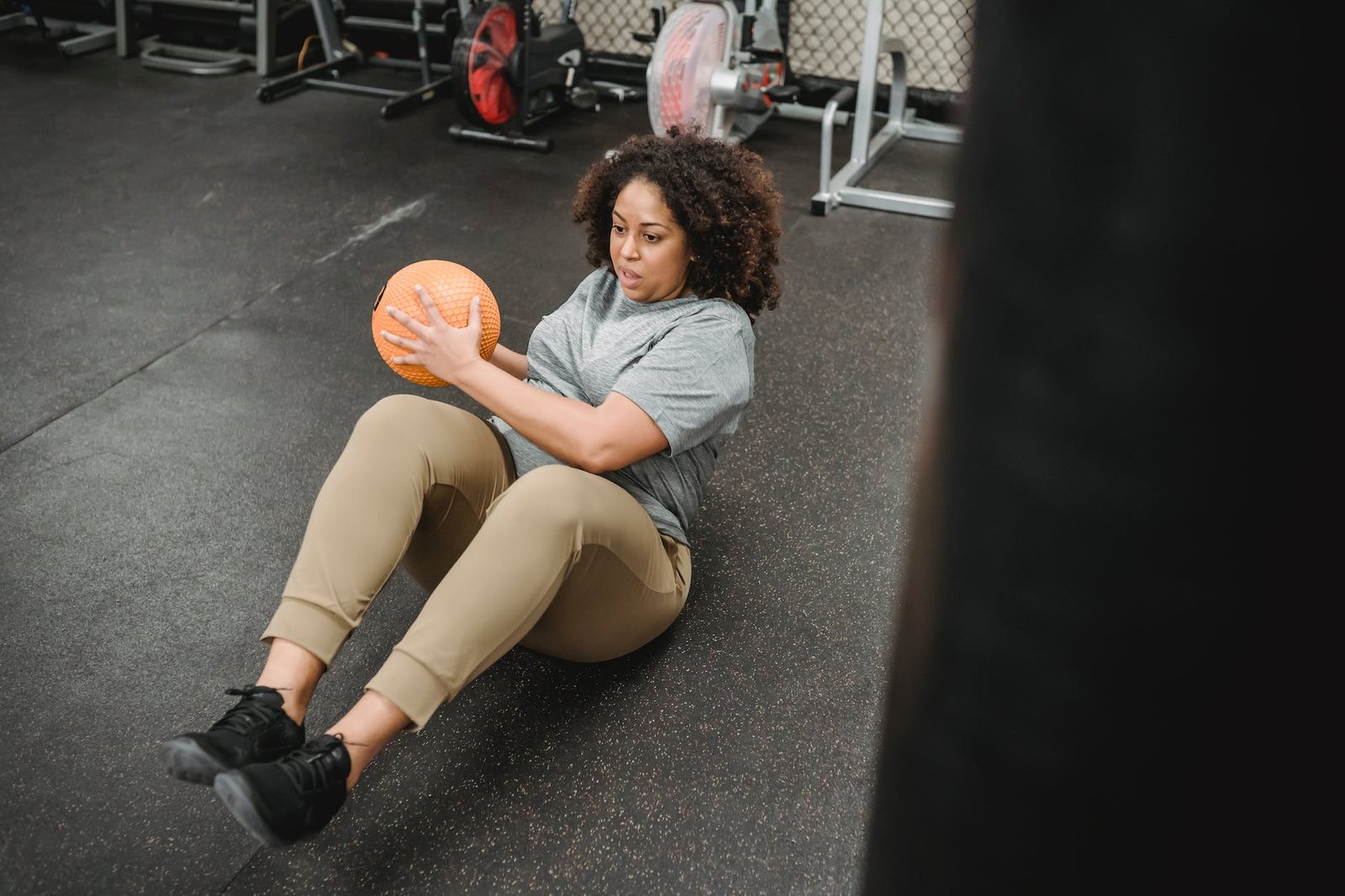black woman with ball pumping press